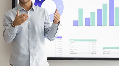 Marketing manager presenting advertising ROI in front of graphs